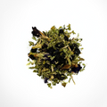 A pile of dried blueberry-licious tea leaves with floral notes, a mix of green and blue hues