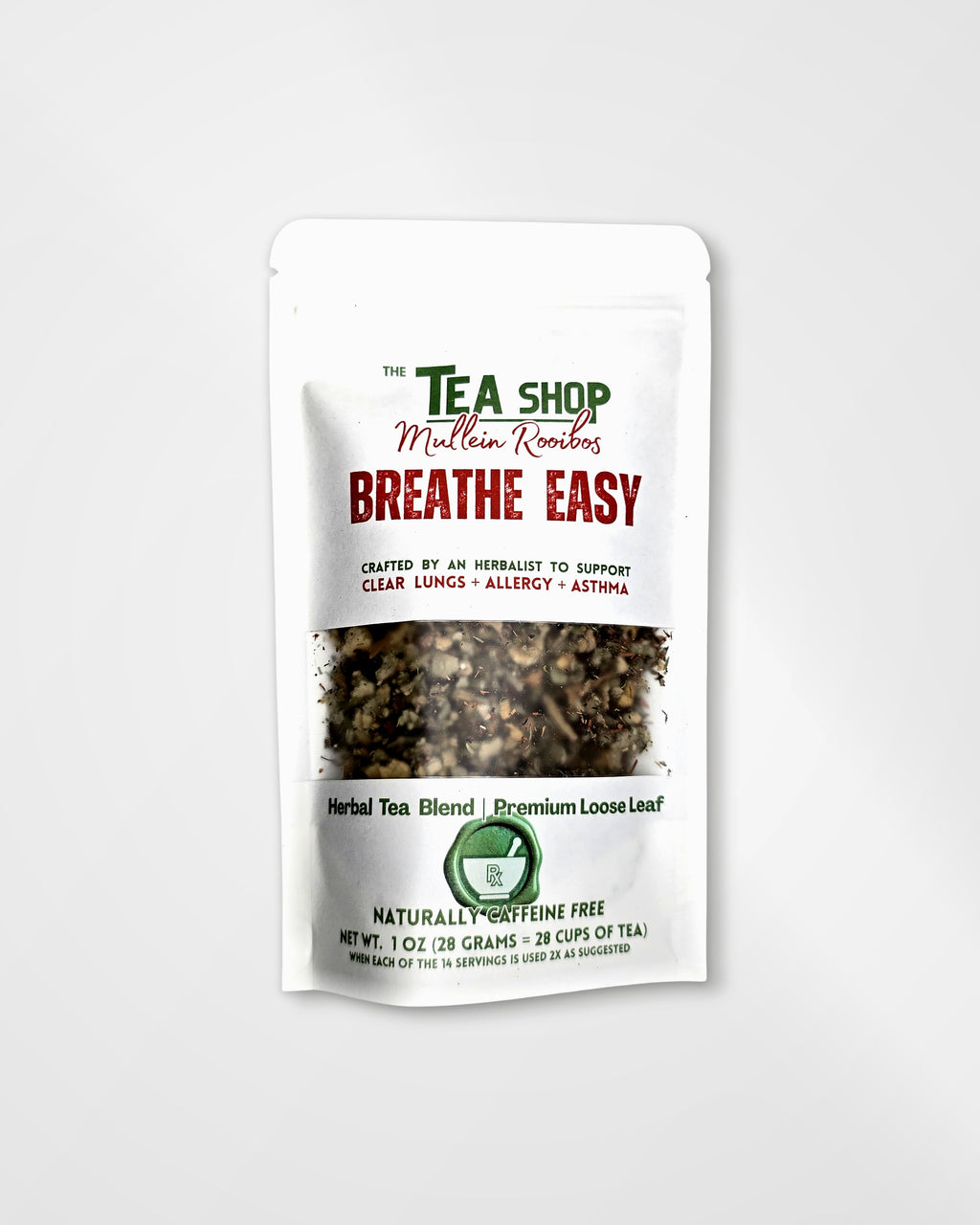 A white stand-up pouch of herbal tea blend from 'The Tea Shop' with a clear window showing the loose leaf tea inside. The packaging features green and red text, including the product name 'Breathe Easy'.