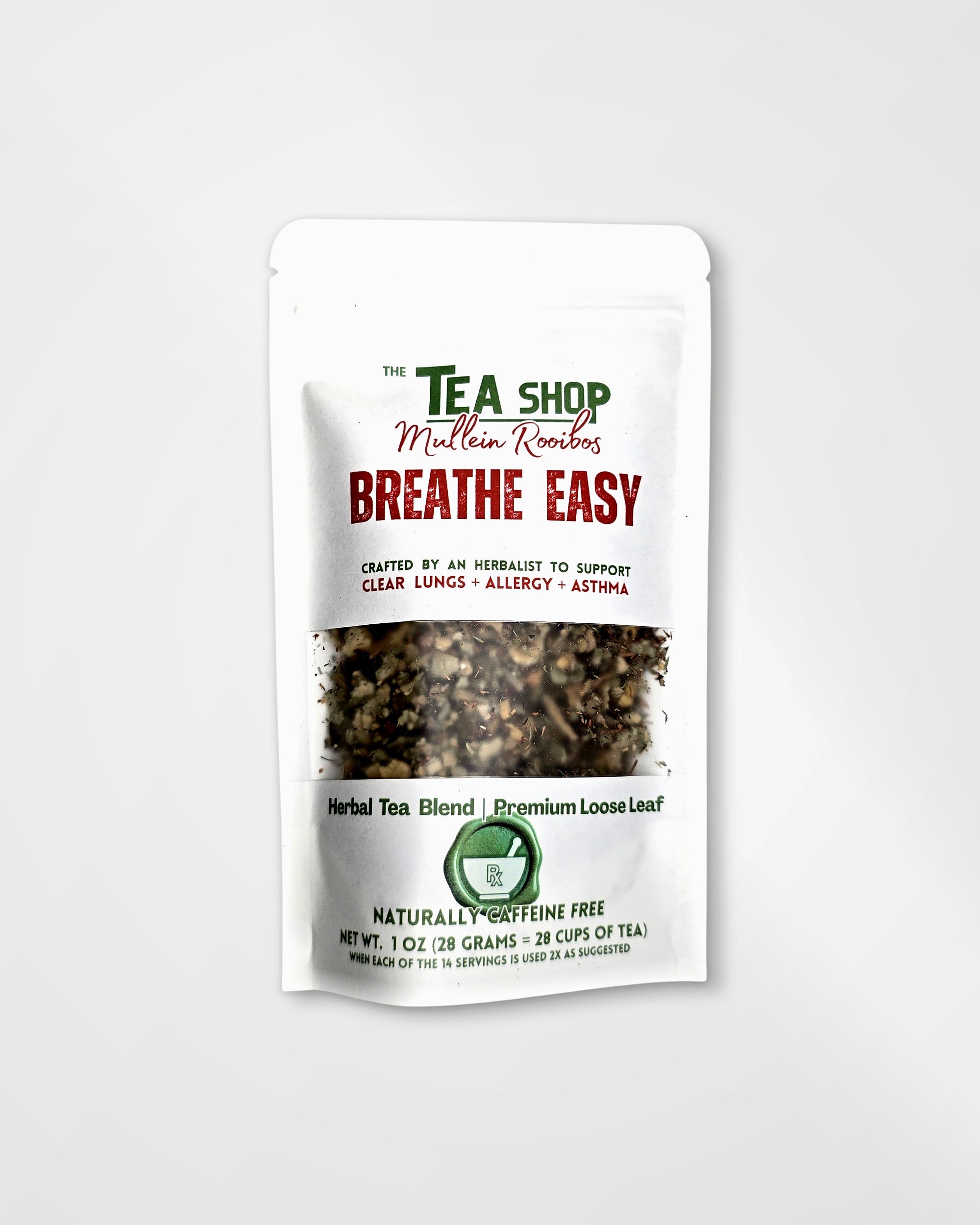 A white stand-up pouch of herbal tea blend from 'The Tea Shop' with a clear window showing the loose leaf tea inside. The packaging features green and red text, including the product name 'Breathe Easy'.
