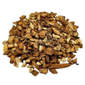 Heap of dried herbs on a white background