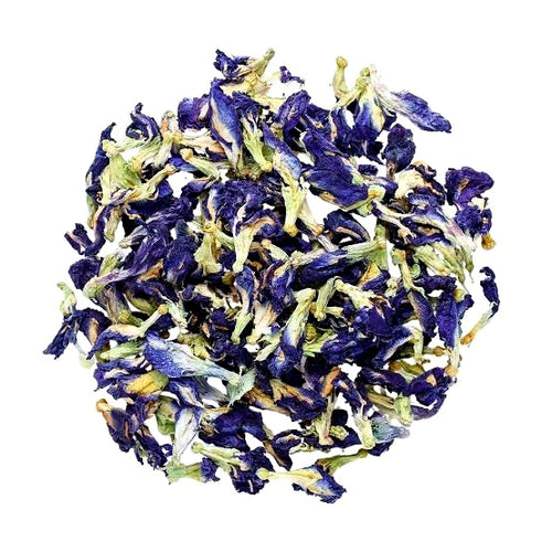 A pile of dried butterfly pea flowers, showing deep blue-purple petals mixed with pale green and yellowish-green stems, isolated on a solid white background.