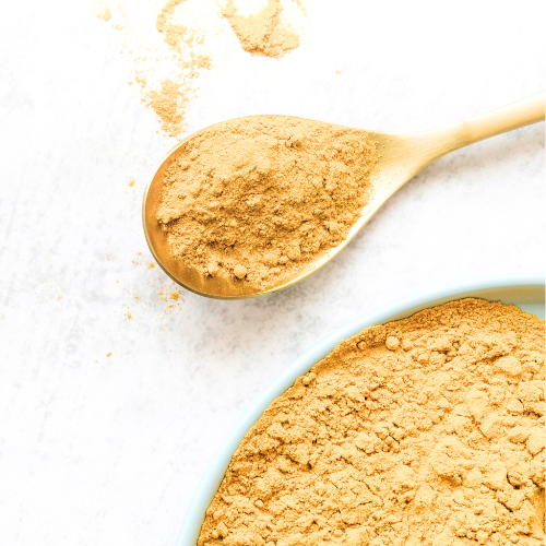 Yellow Chai powder on a white background