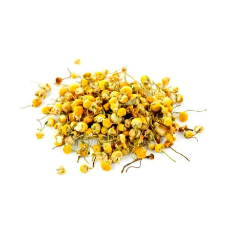 A small pile of dried yellow chamomile flowers with green stems on a plain white background.