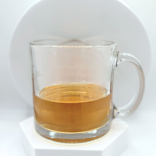 Image of chocolate venus tea in clear mug on white background