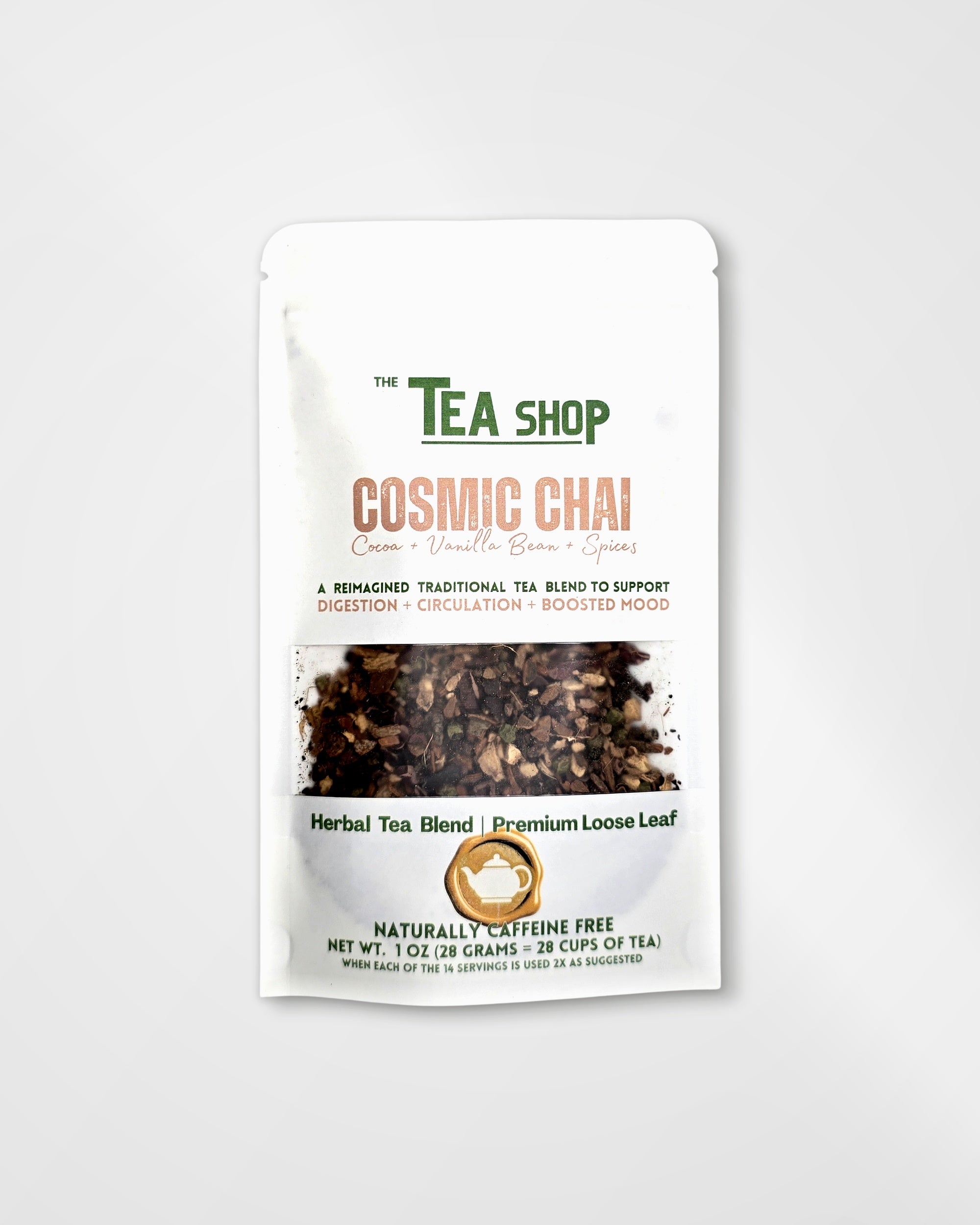 A stand-up pouch of 'The Tea Shop' Cosmic Chai herbal tea blend, featuring a white background with green and peach text and a clear window showing the dark herbal tea inside.