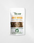 A stand-up pouch of 'The Tea Shop' Sweet Citrus Sona Gentle Refresh herbal tea blend, shown on a clean white background. The packaging is white with green and orange text, featuring a clear window displaying the loose leaf tea blend inside.