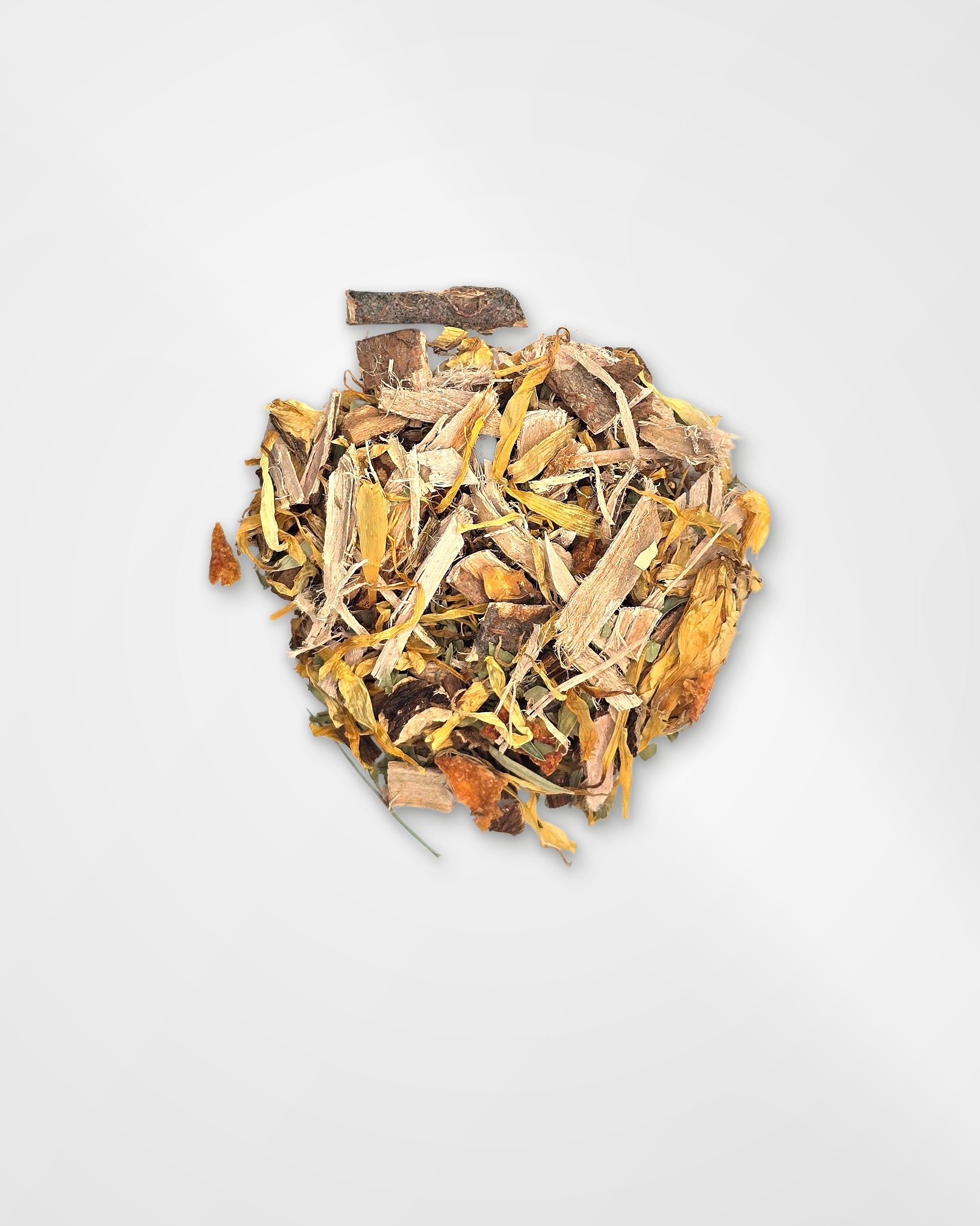 A small pile of loose dried botanical tea or spice blend with yellow, tan, brown, and orange pieces, photographed on a clean light gray background.