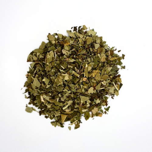 Heap of dried yerba mate and peppermint on a white background 