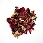 Heap of dried red and brown flowers on a white background