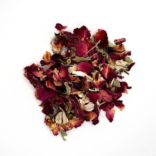 Heap of dried red and brown flowers on a white background