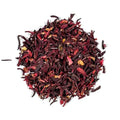 A pile of dried hibiscus tea leaves, showing deep red, purple, and dark brown tones with small pale yellow accents, photographed on a solid white background.