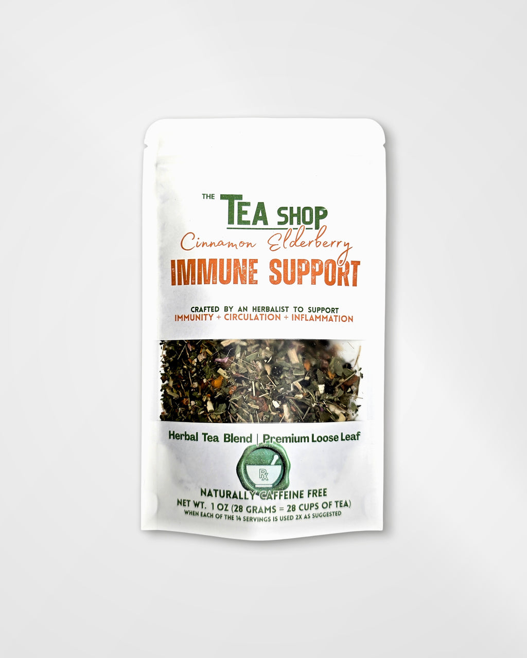 A white stand-up pouch of 'The Tea Shop' Cinnamon Elderberry Immune Support herbal tea blend, featuring a clear window showing the loose leaf tea inside.