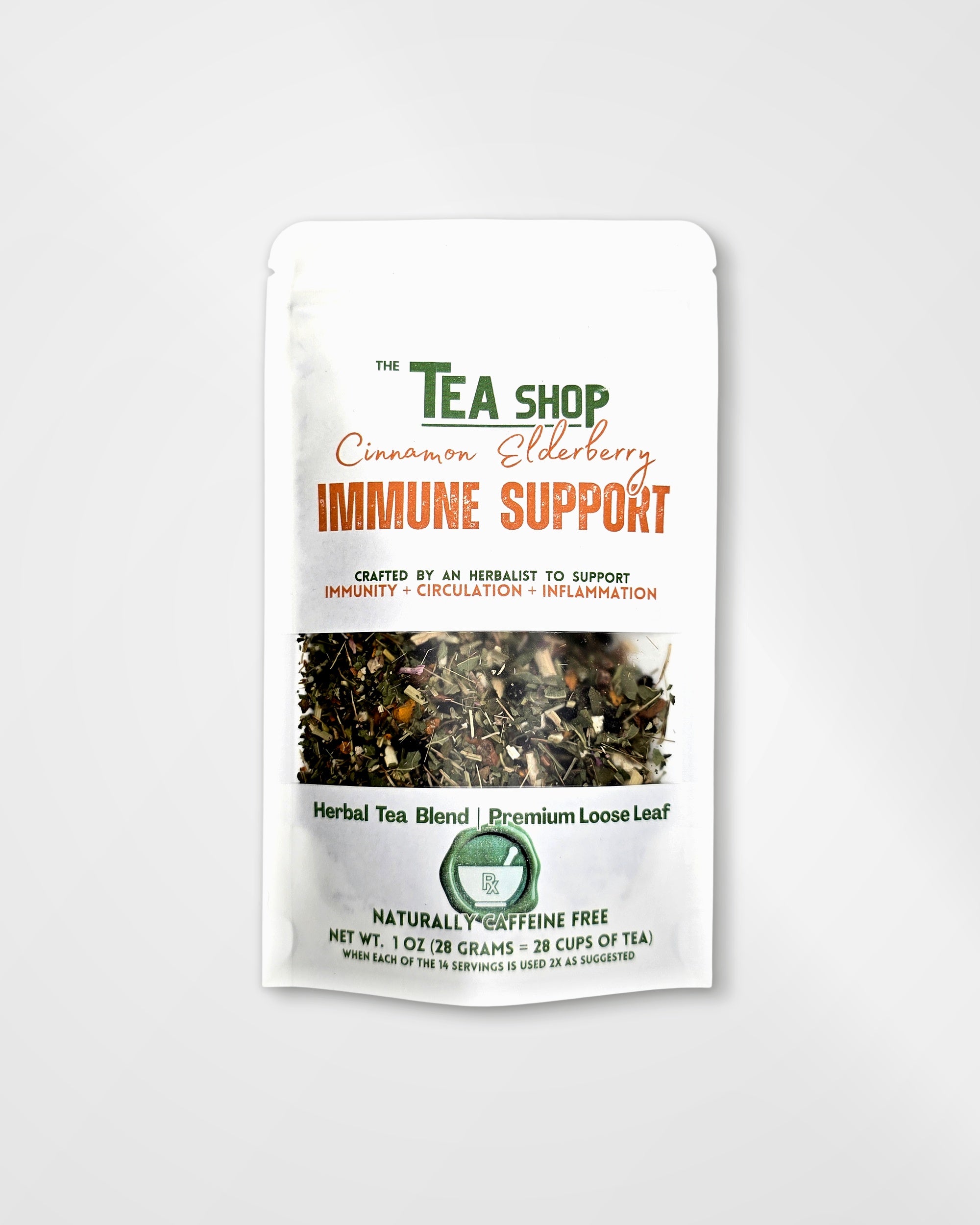 A white stand-up pouch of 'The Tea Shop' Cinnamon Elderberry Immune Support herbal tea blend, featuring a clear window showing the loose leaf tea inside.