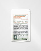 A single white RX Tea Shop tea packet with orange and black text, photographed against a light gray background.