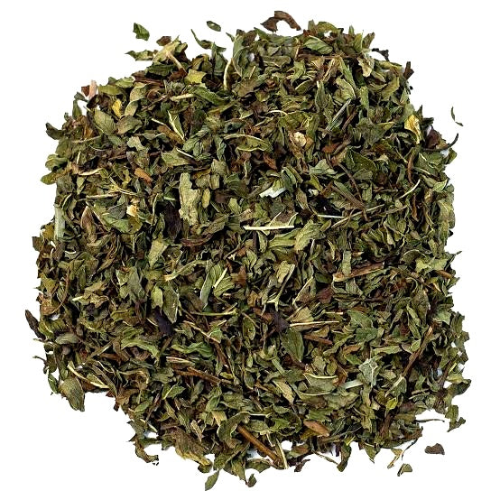 A pile of loose, dried peppermint  leaves on a solid white background 