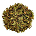 A pile of dried, chopped green and brown leaves, likely herbal tea or botanicals, isolated on a solid white background.