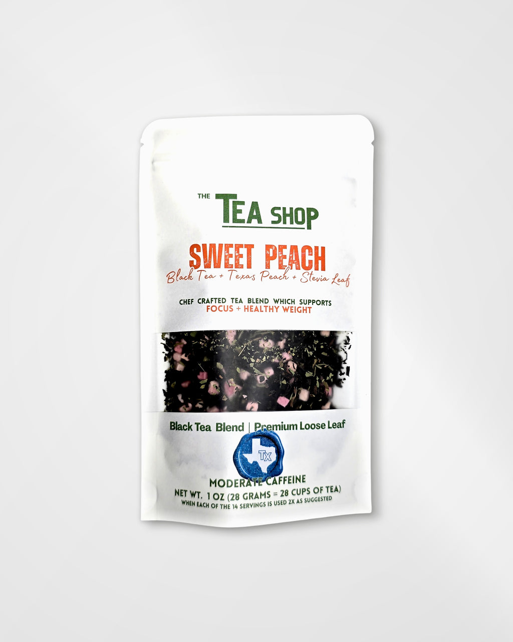 A white stand-up pouch of 'The Tea Shop' Sweet Peach tea blend, featuring green and orange text, a central photo of peach pieces, and a blue circular logo near the bottom, set against a light gray background.