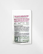 A single white stand-up pouch of The RX Tea Shop black tea, shown against a plain white background. The back of the pouch features detailed product information, ingredients, benefits, and a QR code in black and dark red text.