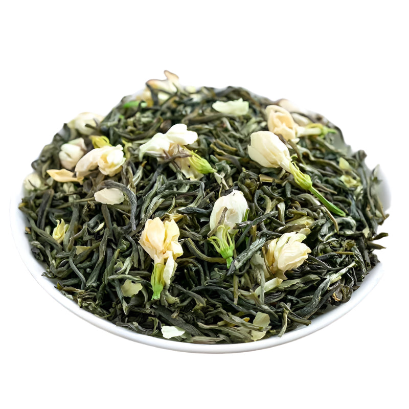Green tea leaves with jasmine flowers in a white bowl on a wooden surface