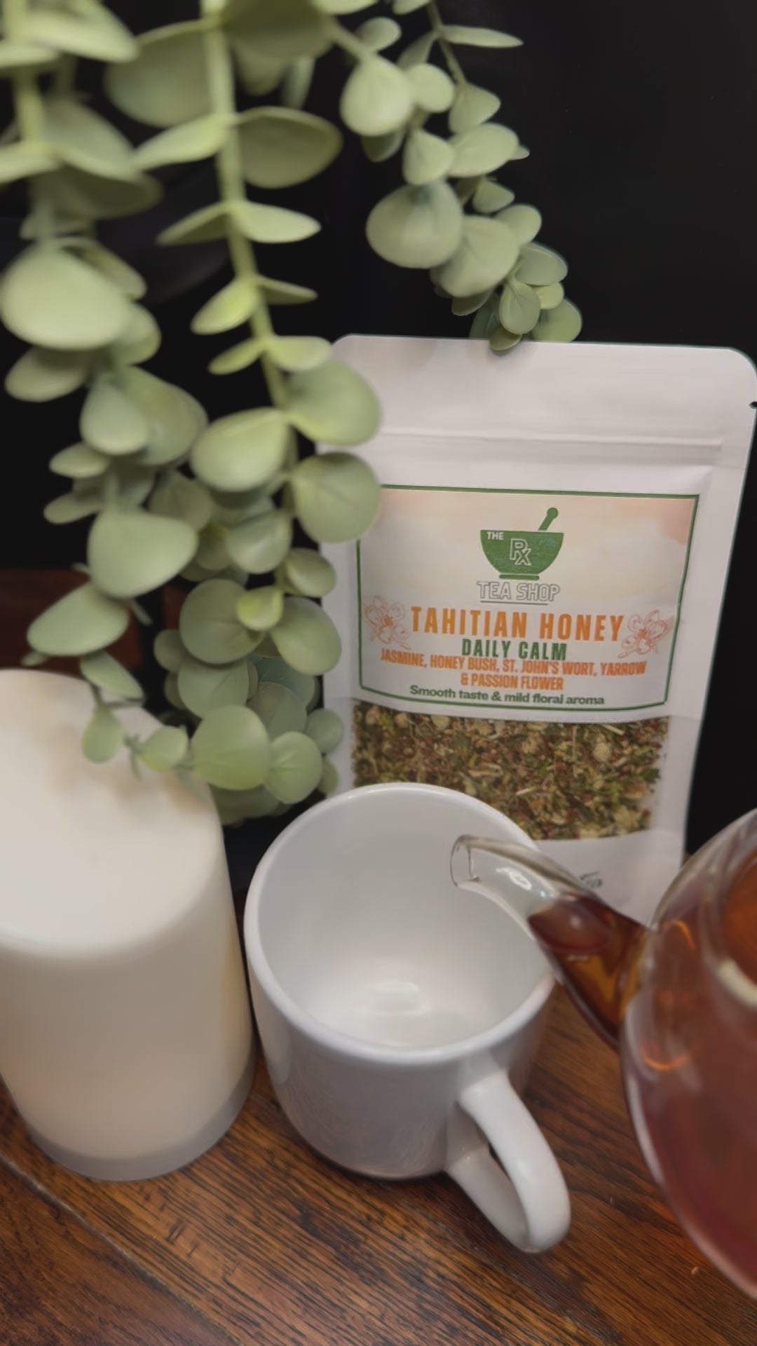 Short video clip of Tahitian Honey tea being pored into white teacup with a earthy toned background 