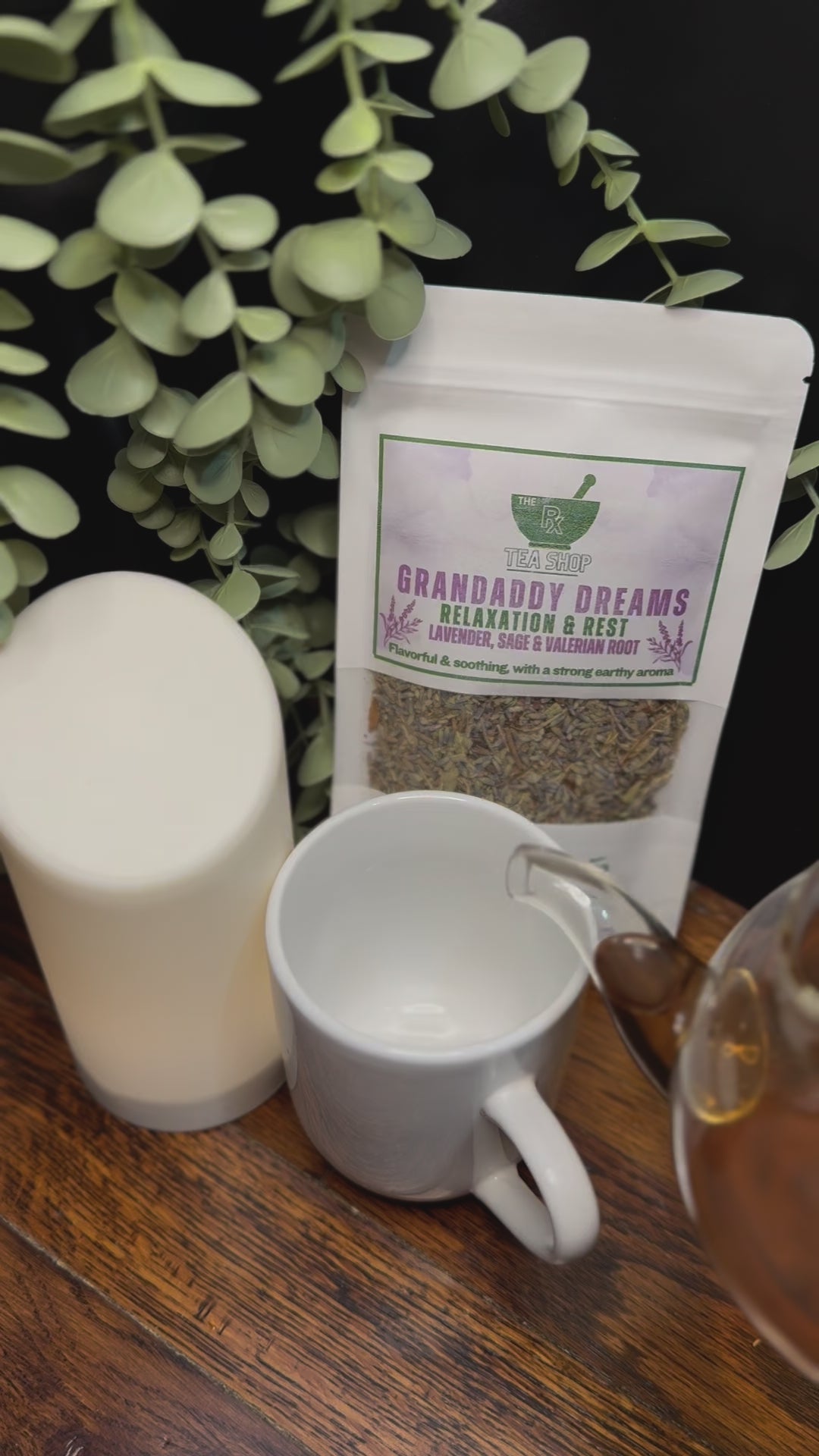 Short video clip of Grandaddy Dreams tea being poured into white teacup in a earthy toned background